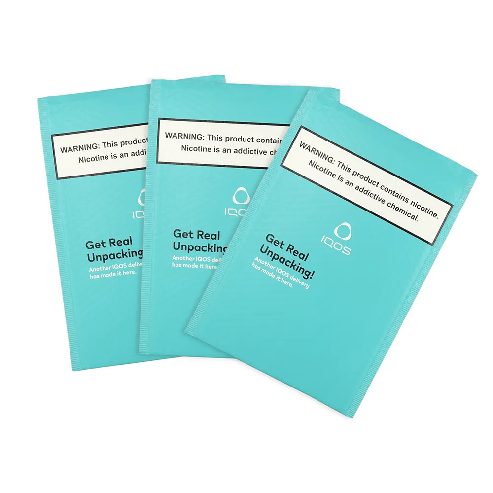 Three turquoise bubble mailers with address-label panels