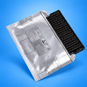 Black component tray partly inserted into a foil barrier bag