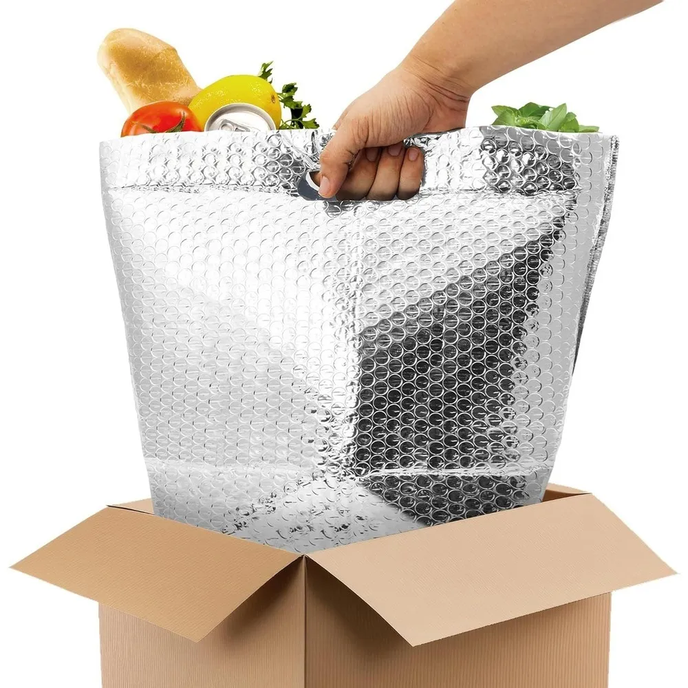 Reflective liner with packaged groceries being placed into a carton