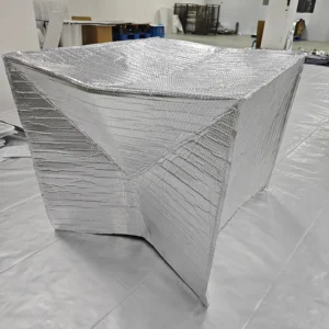 Large silver cover showing folded and sewn panels