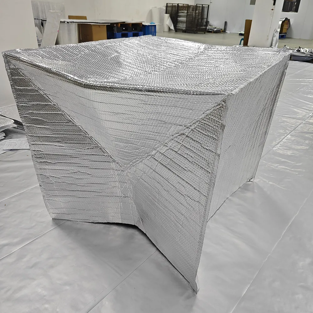 Large silver cover showing folded and sewn panels